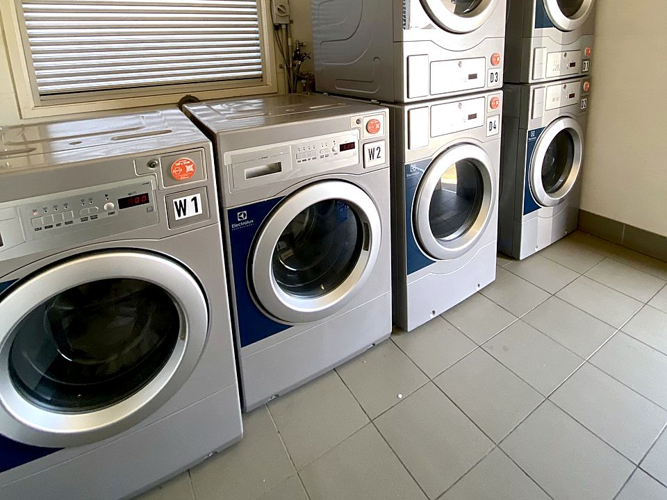Guest laundry with commercial washers and dryers